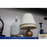 A white glazed table lamp with a pierced border an