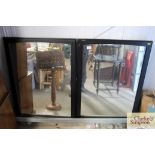 Two wooden framed wall mirrors