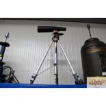 A Nickel 16 x 50 spotting scope together with trip