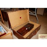 A vintage suitcase; and two rosewood trinket boxes