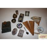A box of miscellaneous items including a carved Ch