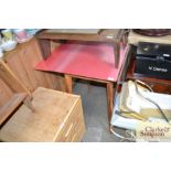 A Formica topped drop leaf kitchen table