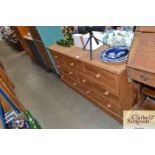 A pine multi drawer sideboard