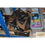 A box containing vintage ice skates and a pair of