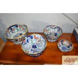 An ironstone amhurst Japan pedestal bowl; two others similar and an Imari pattern bowl