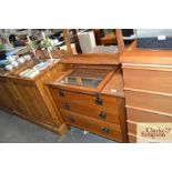 A satin wood dressing chest fitted three long drawers