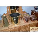 Two copper kettles; a brass jug; and brass coal bu