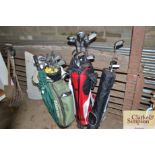 Three golf bags and contents