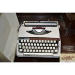 A Brother Deluxe 900 typewriter in fitted carry ca