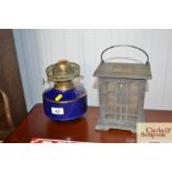 A blue and gilt oil lamp font; and a solar powered