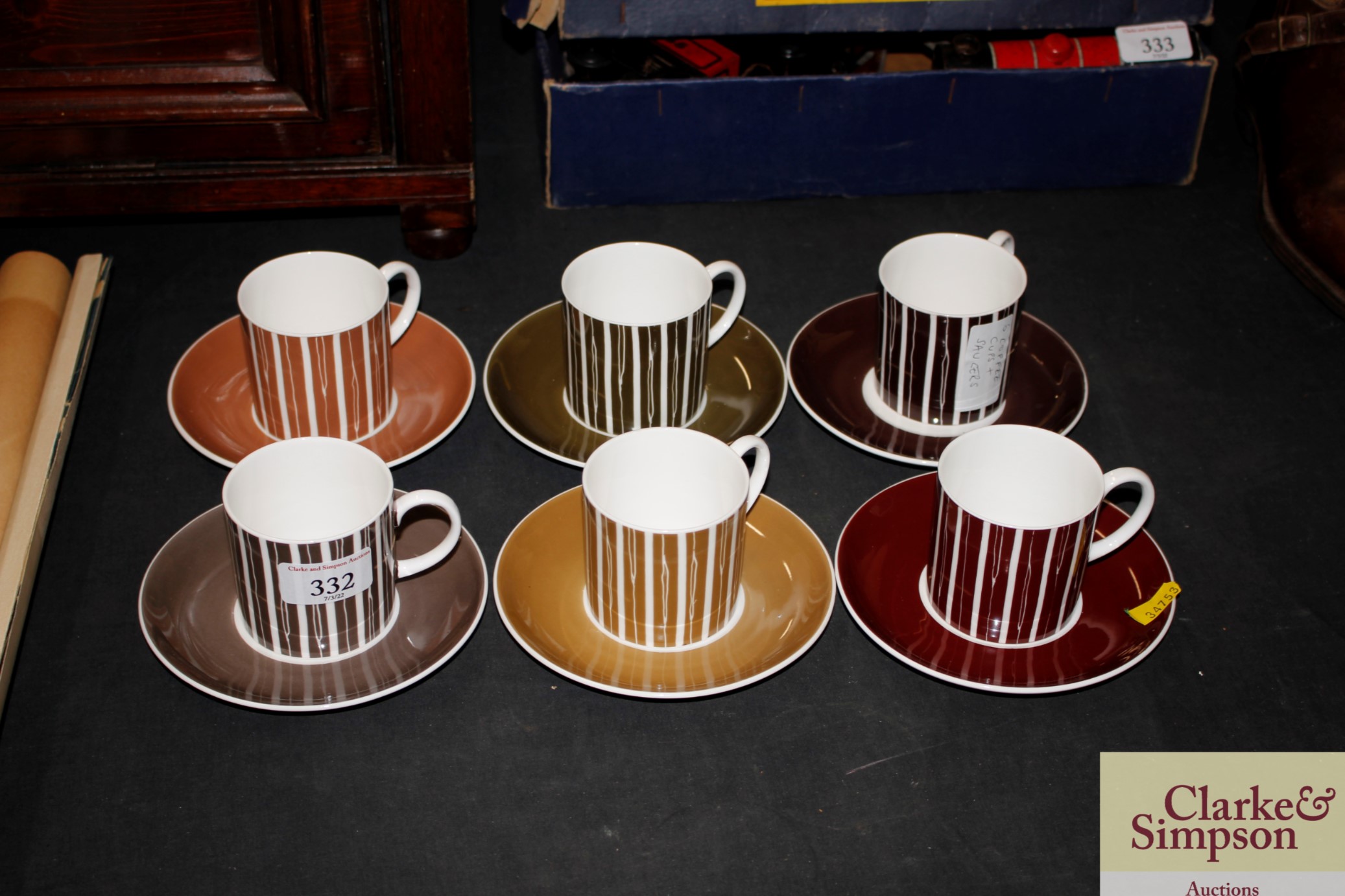 A set of six Susie Cooper coffee cans and saucers
