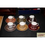 A set of six Susie Cooper coffee cans and saucers