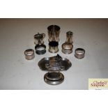 A cruet set; four napkin rings; snuff box; and a t