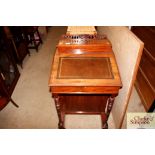 An Edwardian walnut Davenport desk