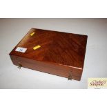 A mahogany box with contents of a pottery tray and