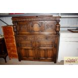A carved oak court cupboard