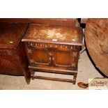 A small carved oak cupboard