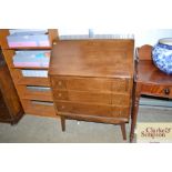 An oak bureau fitted three drawers