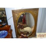 A gilt framed wall mirror