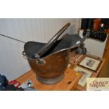 A copper coal scuttle