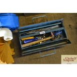 A metal tool box and contents