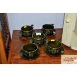 A set of five soup bowls and saucers