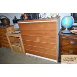 A teak effect chest, fitted six long drawers