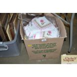 A box of various table napery and various material