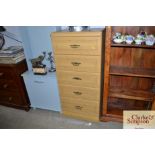 An Alstons five drawer pine effect chest