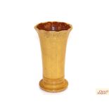 A Ewenny brown pottery slip glazed vase, 23cm high