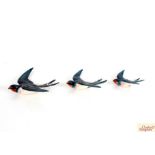 A set of three Beswick graduated flying swallows