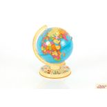 A mid-20th Century tin world globe