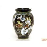 A Gouda pottery vase of dragon pattern, 27cm high