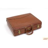 A Hartmann Knockabout leather suitcase initialled