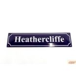 A small replica enamel advertising sign, "Heatherc