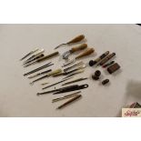 A collection of various sewing items, needle cases