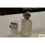 Two cut glass and silver mounted scent bottles