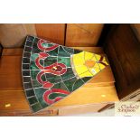 A Tiffany style stained glass and leaded panel