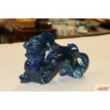 An Oriental blue glazed dragon ornament