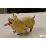 A cast iron articulated pig money box