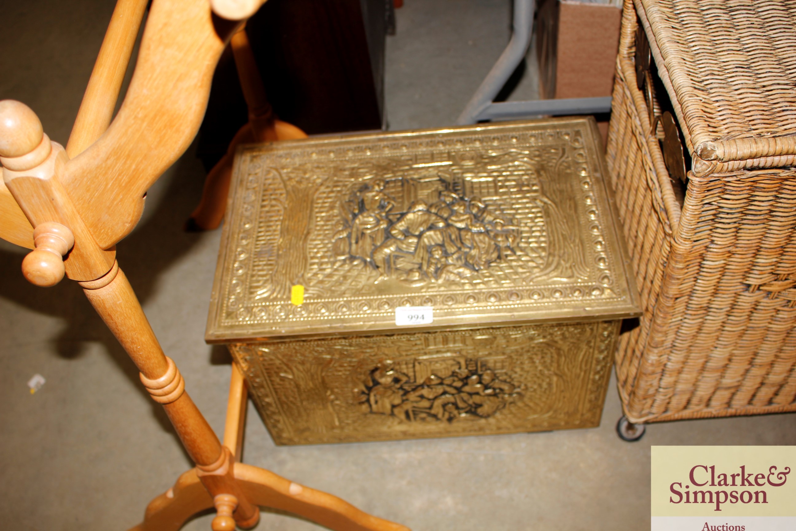 A brass embossed coal box decorated with tavern scenes