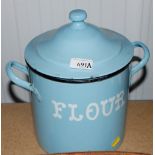 A blue enamel flour bin