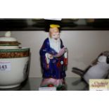 A Chinese porcelain figure of Shoulou