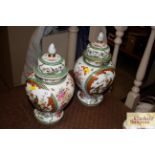 A pair of continental porcelain baluster vases and