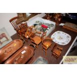 A collection of five signed Stuart King wooden miniature Windsor and other stick back chairs