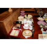 A quantity of various decorative china to include cake stand, fruit bowls, cased set of fish