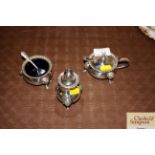 A three piece pated cruet set