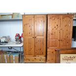 A modern pine wardrobe fitted single drawer below