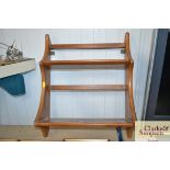 A hanging Ercol plate rack