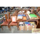 A faux walnut extending dining table together with